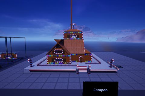 Image from the game Satisfactory featuring a scene depicting a gingerbread house adorned with candy, using various items from the game's build tools. A tall pole sticks out of the roof of the building disappearing off-frame.