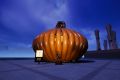 Image from the game Satisfactory featuring the third-place winner in a pumpkin contest, featuring a rather large pumpkin made out of the game's pipes.
