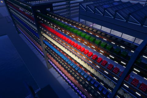 Image from the game Satisfactory featuring an industrial building surrounded by a tall security fence made from conveyor belts filled with resources from the game. This shot features a close-up highlighting each layer of the fence.