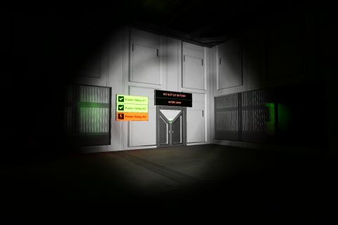 Image from the game Satisfactory featuring a scene from a haunted house attraction depicting the interior of a power distribution facility with a sign over the exit instructing people "DO NOT GO OUTSIDE AFTER DARK", with additional signs by the exit indicating that "Power Relay #3" is offline, requiring the person attending the attraction to "go outside after dark".