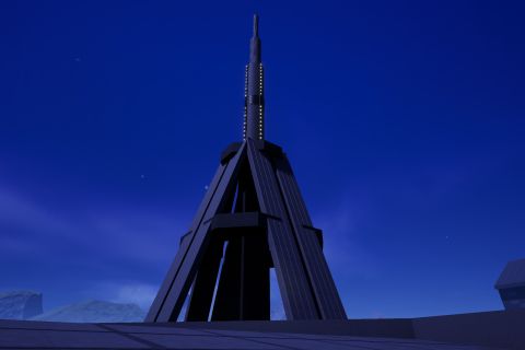 Image from the game Satisfactory featuring a memorial building, shot focussing on the spire of the memorial building.