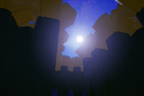 Image from the game Satisfactory featuring a shot from inside a corn maze built in the game.