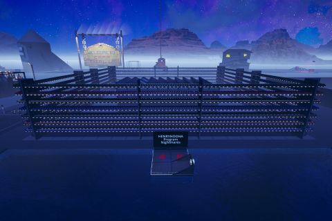 Image from the game Satisfactory featuring an industrial building surrounded by a tall security fence made from conveyor belts filled with resources from the game.